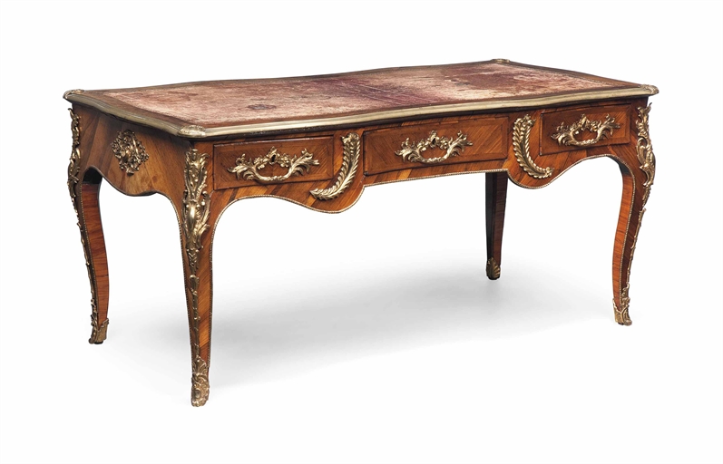 A LOUIS XV ORMOLU-MOUNTED ROSEWOOD BUREAU PLAT 
BY JEAN-BAPTISTE GALET, CIRCA 1760 
With a gilt-