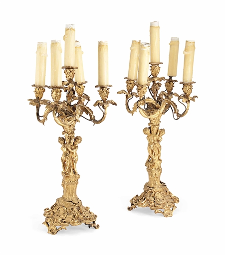 A PAIR OF FRENCH GILT-BRONZE FIVE-LIGHT CANDELABRA 
MID-19TH CENTURY 
The stems modelled with