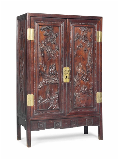 A CHINESE ROSEWOOD CABINET 
QING DYNASTY (1644-1912), LATE 19TH CENTURY 
The pair of doors deeply