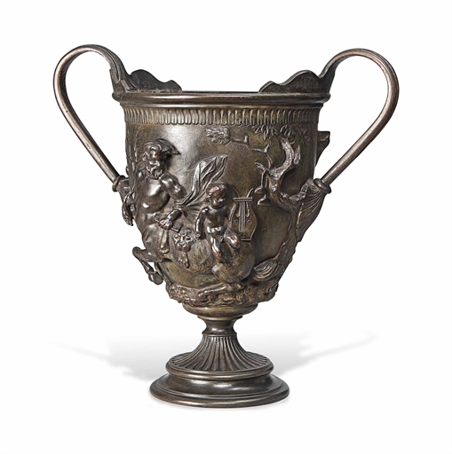 AN ITALIAN BRONZE URN 
CIRCA 1900 
The body cast with classical figures and centaurs 
17 in. (43