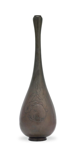 A Japanese Bronze Vase 
Meiji period (late 19th century) 
With tall elongated neck, chased and