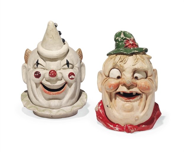 TWO CONTINENTAL PAPIER-MACHE PARADE MASKS 
CIRCA 1940 
One modelled as a grinning Pierrot clown, the