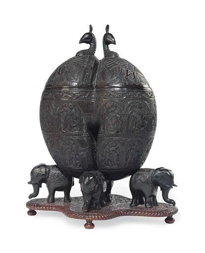 A CARVED COCO-DE-MER (LODOICEA MALDIVICA) 
WEST COAST OF INDIA OR CEYLON, 19TH CENTURY 
Of typical