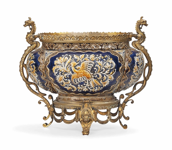 A FRENCH GILT-BRONZE AND EARTHENWARE CHINOISERIE JARDINIERE 
CIRCA 1880 
The bowl painted and