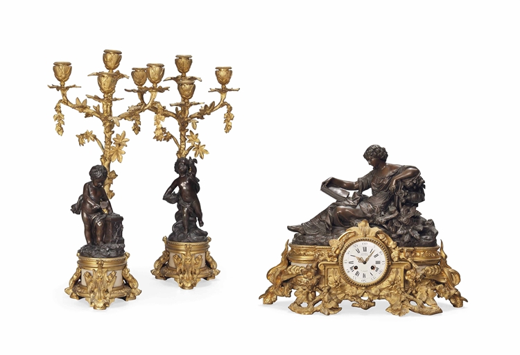 A FRENCH THREE-PIECE GILT AND PATINATED BRONZE AND MARBLE CLOCK GARNITURE
THE CLOCK BY DENIERE,