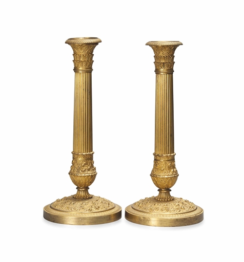 A PAIR OF CHARLES X GILT BRONZE CANDLESTICKS 
CIRCA 1825 
The fluted stems with acanthus capping