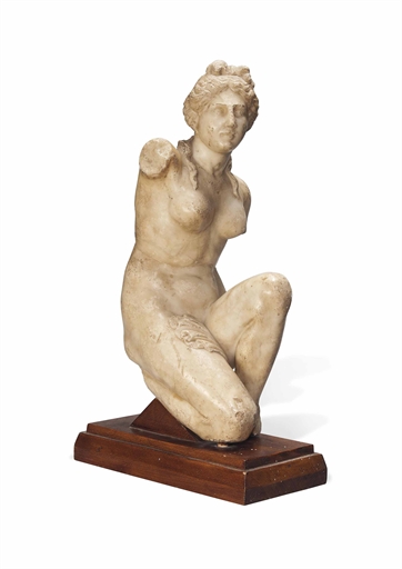 AN ITALIAN ALABASTER MODEL OF THE CROUCHING VENUS 
19TH CENTURY 
After the Antique, on a walnut