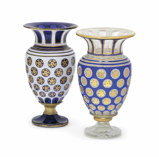 A HARLEQUIN PAIR OF BOHEMIAN CUT AND OVERLAY GLASS VASES 
CIRCA 1860 
Comprising one blue-flash with