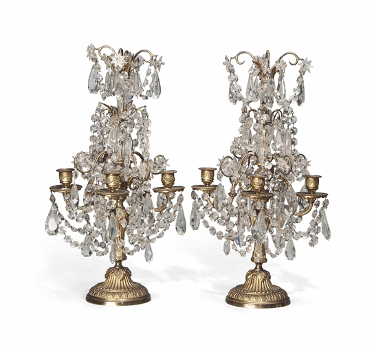 A PAIR OF FRENCH GILT-BRONZE AND GLASS FOUR-LIGHT GIRANDOLES 
EARLY 20TH CENTURY, IN THE MANNER OF