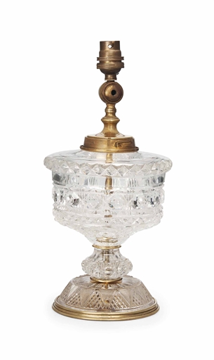 AN ENGLISH BRASS-MOUNTED CUT-GLASS SHIP'S LAMP 
EARLY 20TH CENTURY, BY F.& C. Osler 
The body with