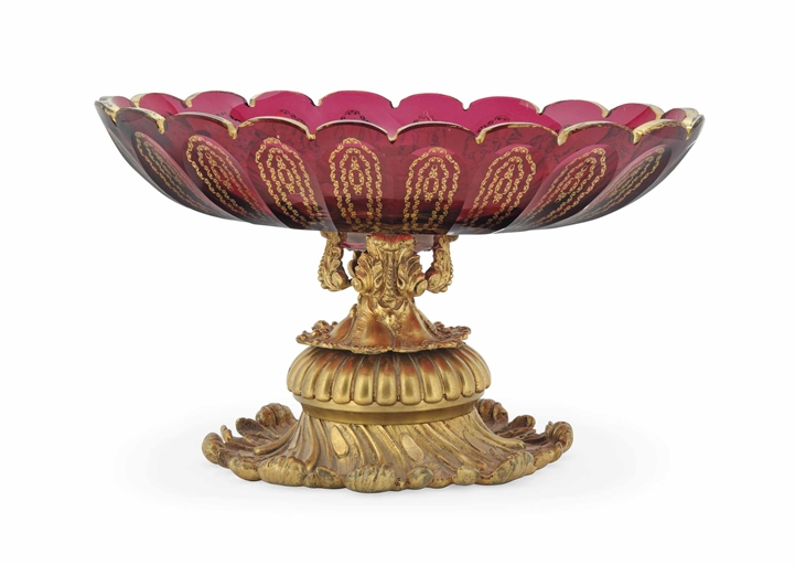 A GILT-METAL-MOUNTED CRANBERRY GLASS BOWL 
20TH CENTURY 
With scalloped rim, the sides gilt with