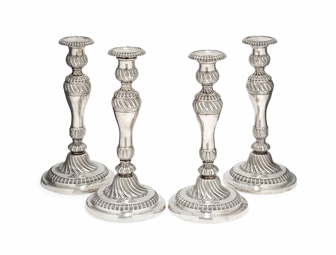 A MATCHED SET OF FOUR GEORGE III SILVER CANDLESTICKS 
MARK OF SMITH, TATE AND CO., SHEFFIELD, TWO