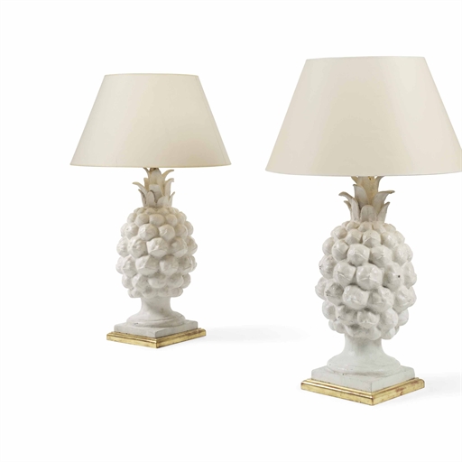 A PAIR OF WHITE-PAINTED TERRACOTTA LAMPS 
MODERN 
Modelled as pineapples on giltwood plinth bases,