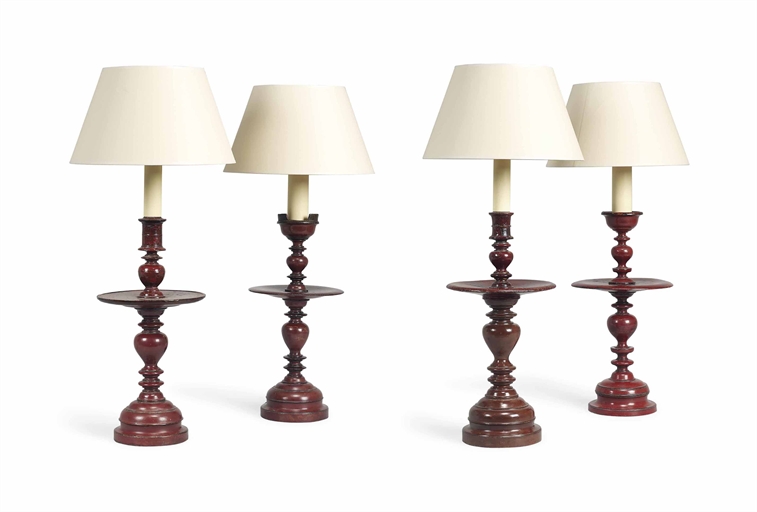 FOUR RED-LACQUERED CANDELSTICK LAMPS 
EARLY 20TH CENTURY 
Fitted for electricity, the decoration