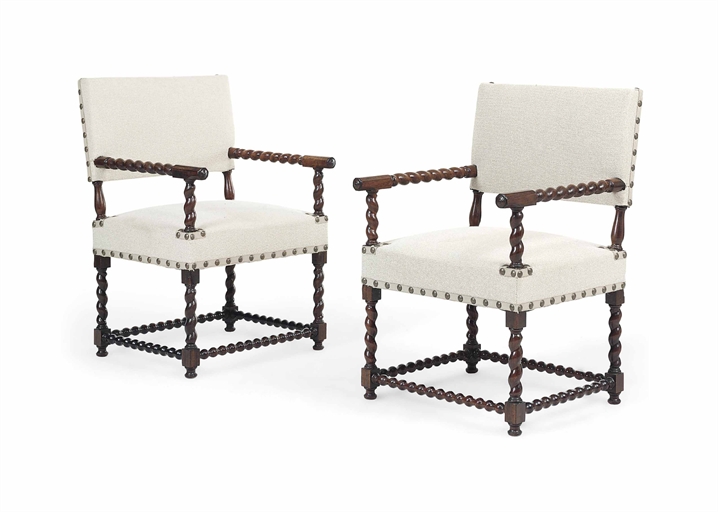 A PAIR OF ROSEWOOD ARMCHAIRS 
MID-19TH CENTURY, POSSIBLY PORTUGUESE 
Each with cream close-nailed