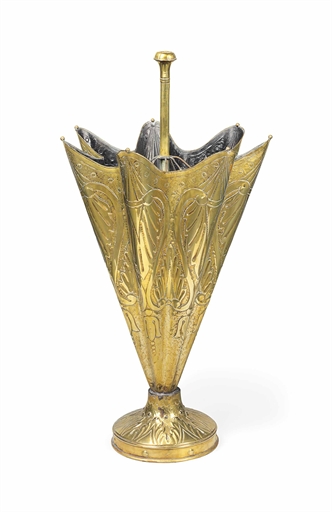 A BRASS UMBRELLA STAND 
EARLY 20TH CENTURY 
35 in. (89 cm.) high 
View on Christie's.com