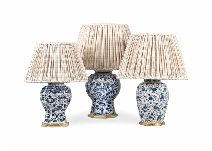 THREE DUTCH DELFT BLUE AND WHITE VASE LAMPS 
18TH CENTURY AND LATER 
Painted in the Chinese style