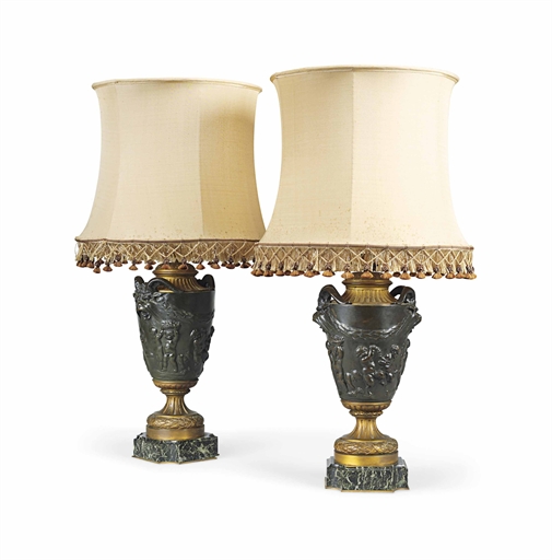 A PAIR OF LOUIS XVI STYLE BRONZE AND ORMOLU URNS 
LATE 19TH CENTURY, AFTER CLODION 
Each on a