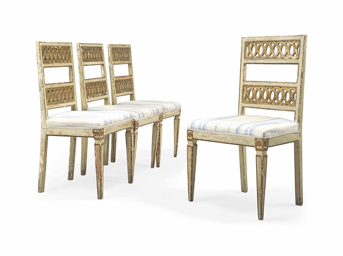 A SET OF FOUR NORTH ITALIAN PARCEL-GILT AND CREAM-PAINTED SIDE CHAIRS 
EARLY 19TH CENTURY 
Each seat