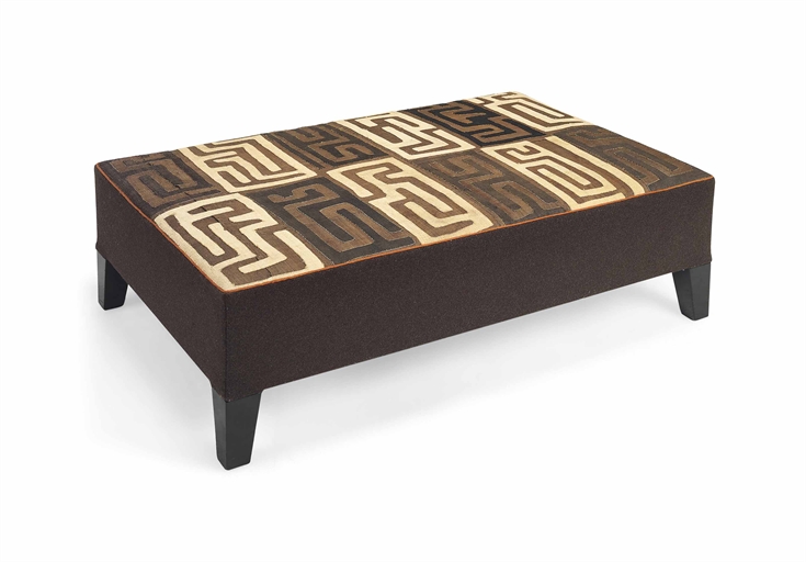 AN AFRICAN KUBA CLOTH-COVERED OTTOMAN 
BY COLEFAX AND FOWLER, MODERN 
On ebonised tapering feet 
15½