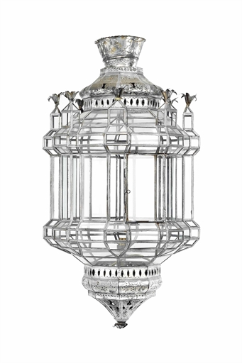 A NORTH AFRICAN TIN AND GLASS HANGING LANTERN 
20TH CENTURY 
Fitted for electricity 
35 in. (89 cm.)