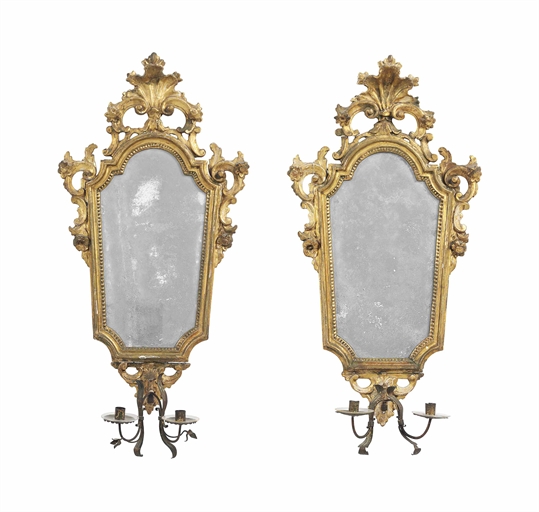 A PAIR OF VENETIAN GILTWOOD GIRANDOLES 
SECOND HALF 18TH CENTURY 
Each tapering plate with tôle twin