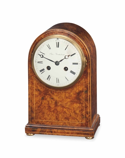 AN EDWARDIAN BURR WALNUT STRIKING TABLE CLOCK 
RETAILED BY CHARLES FRODSHAM, EARLY 20TH CENTURY 
The