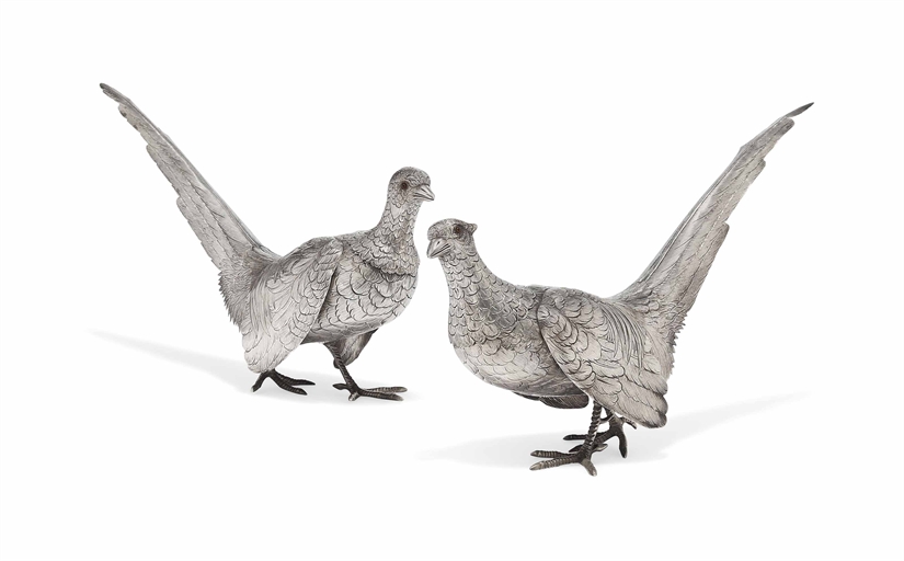 A PAIR OF CONTINENTAL METALWARE PHEASANT TABLE ORNAMENTS 
MARKED 'STERLING', 20TH CENTURY 
With