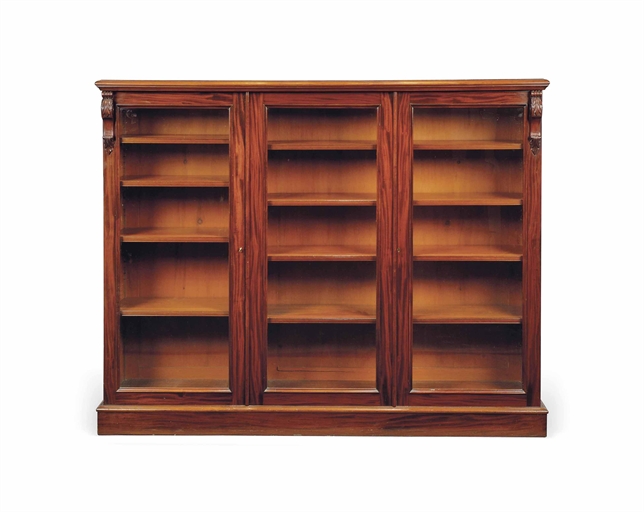 A VICTORIAN MAHOGANY BOOKCASE 
MID-19TH CENTURY 
The moulded top above three glazed doors