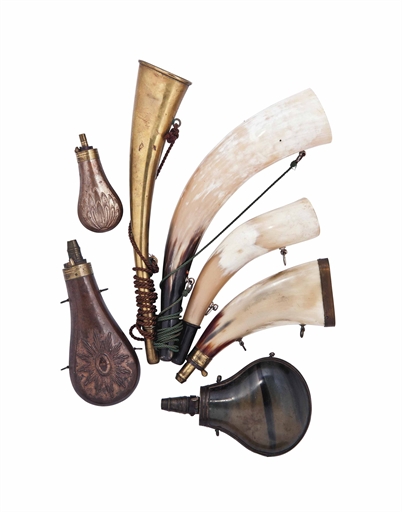 A GROUP OF POWDER-FLASKS AND HUNTING HORNS 
19TH CENTURY 
Comprising a brass-mounted powder-flask,