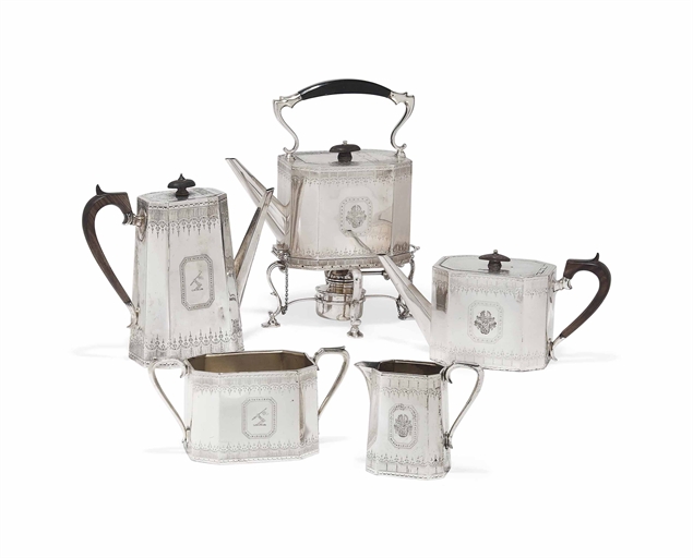 A VICTORIAN SILVER FOUR-PIECE TEA AND COFFEE SERVICE WITH AN AMERICAN KETTLE ON STAND EN SUITE