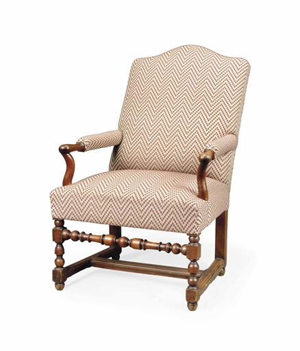 AN ITALIAN WALNUT ARMCHAIR 
LATE 19TH CENTURY 
Re-upholstered in burgundy and grey patterned fabric,