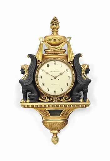 A SWEDISH EBONISED AND GILTWOOD STRIKING CARTEL CLOCK 
THE DIAL SIGNED 'BROR BURMAN, STOCKHOLM', THE