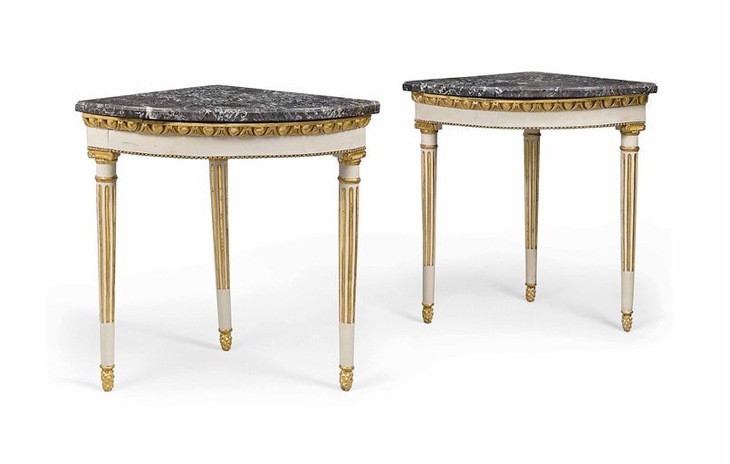 A PAIR OF NORTH EUROPEAN PARCEL-GILT AND CREAM-PAINTED CORNER TABLES 
LATE 18TH/19TH CENTURY 
Each