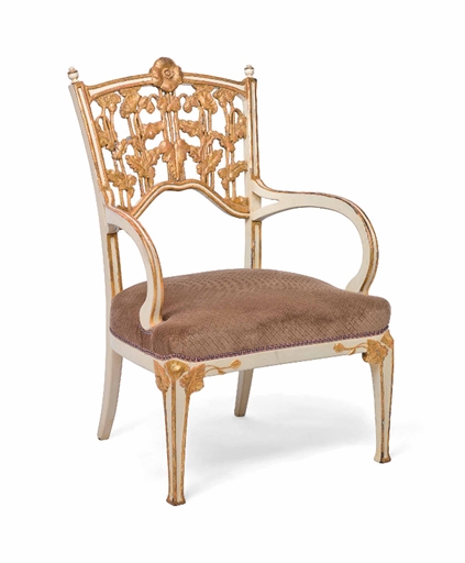 AN ART NOUVEAU CREAM-PAINTED AND PARCEL-GILT FAUTEUIL 
CIRCA 1900 
The arched back carved with