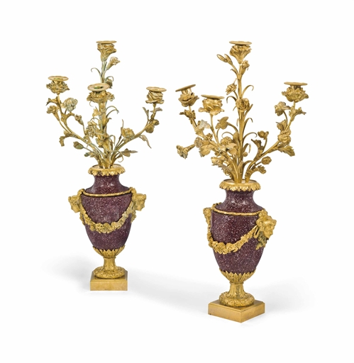 A PAIR OF LOUIS XVI-STYLE ORMOLU-MOUNTED PORPHYRY CANDELABRA 
19TH CENTURY 
Each vase-shaped stem