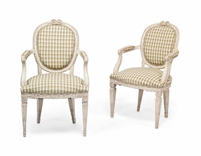 A PAIR OF SWEDISH LOUIS XVI CREAM-PAINTED FAUTEUILS 
LATE 18TH CENTURY 
Each with ribbon-moulded