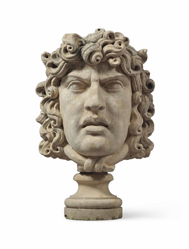 AN ITALIAN COMPOSITION STONE HEAD 
20TH CENTURY, BASED ON THE HEAD OF MEDUSA 
With socle 
32¼ in. (