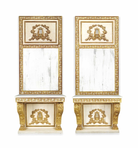 A PAIR OF NORTH EUROPEAN PARCEL-GILT AND CREAM-PAINTED PIER TABLES AND MIRRORS
THE TABLES