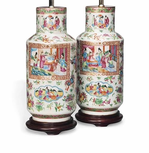 A PAIR OF CANTONESE FAMILLE ROSE VASES 
19TH CENTURY 
Each of rouleau form, decorated with panels