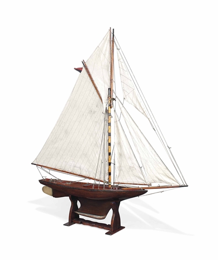 AN ENGLISH POND YACHT 
FIRST HALF 20TH CENTURY 
Rigged with five sails with weighted keel on a later