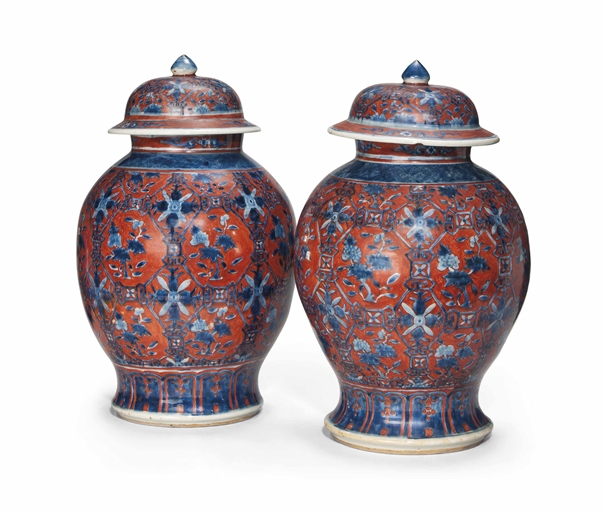 A PAIR OF CLOBBERED IRON-RED AND BLUE BALUSTER VASES AND COVERS 
19TH CENTURY 
Each decorated with