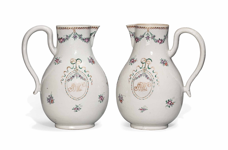 A PAIR OF LARGE CHINESE FAMILLE ROSE MONOGRAMMED EWERS 
QIANLONG PERIOD (1736-95) 
Each of pear