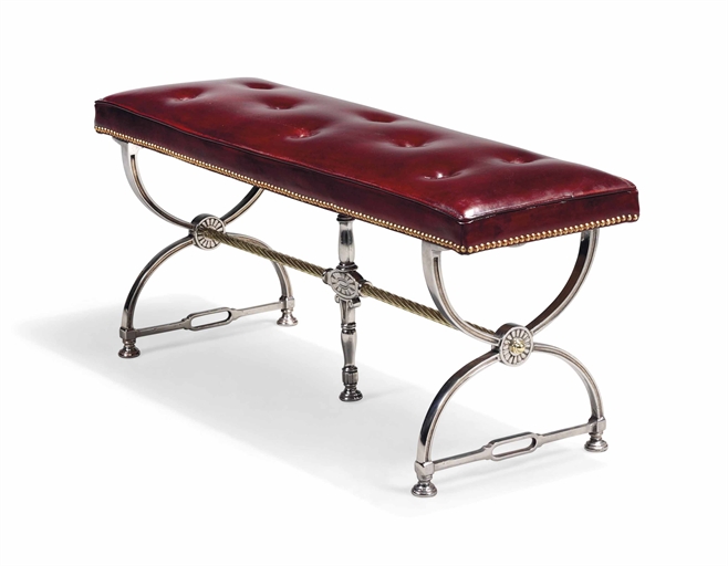 A STEEL AND BRASS STOOL 
EARLY 20TH CENTURY 
With a brass studded red leather buttoned seat and X-