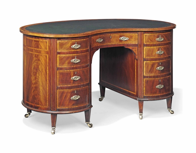 AN EDWARDIAN MAHOGANY AND SATINWOOD CROSSBANDED KIDNEY SHAPED DESK 
EARLY 20TH CENTURY 
The later