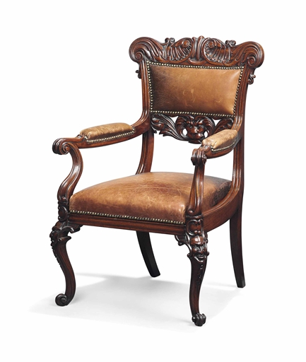 AN INDIAN ROSEWOOD OPEN ARMCHAIR 
PROBABLY COLONIAL, MID-19TH CENTURY 
The acanthus carved top