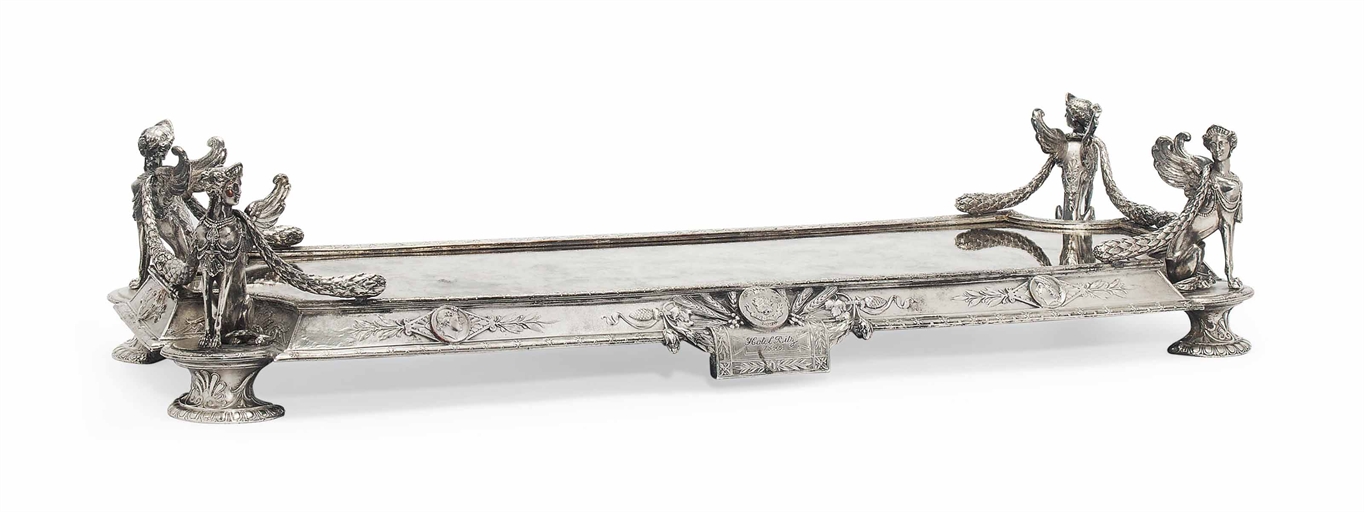 A FRENCH SILVER-PLATED MIRROR PLATEAU 
SIGNED "HOTEL RITZ, PARIS, 1898" 
Rectangular with incurved