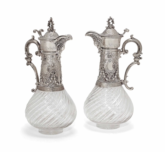 A PAIR OF GERMAN SILVER-MOUNTED CUT GLASS CLARET JUGS 
PROBABLY EARLY 20TH CENTURY 
Baluster form