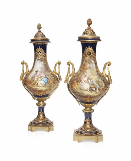 A LARGE PAIR OF SEVRES-STYLE GILT-METAL-MOUNTED DARK-BLUE-GROUND VASES AND COVERS
LATE 19TH CENTURY,