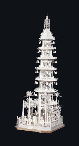 A LARGE IVORY PAGODA AND ORIGINAL DOMED GLASS CASE 
19TH CENTURY 
The seven-tier building is